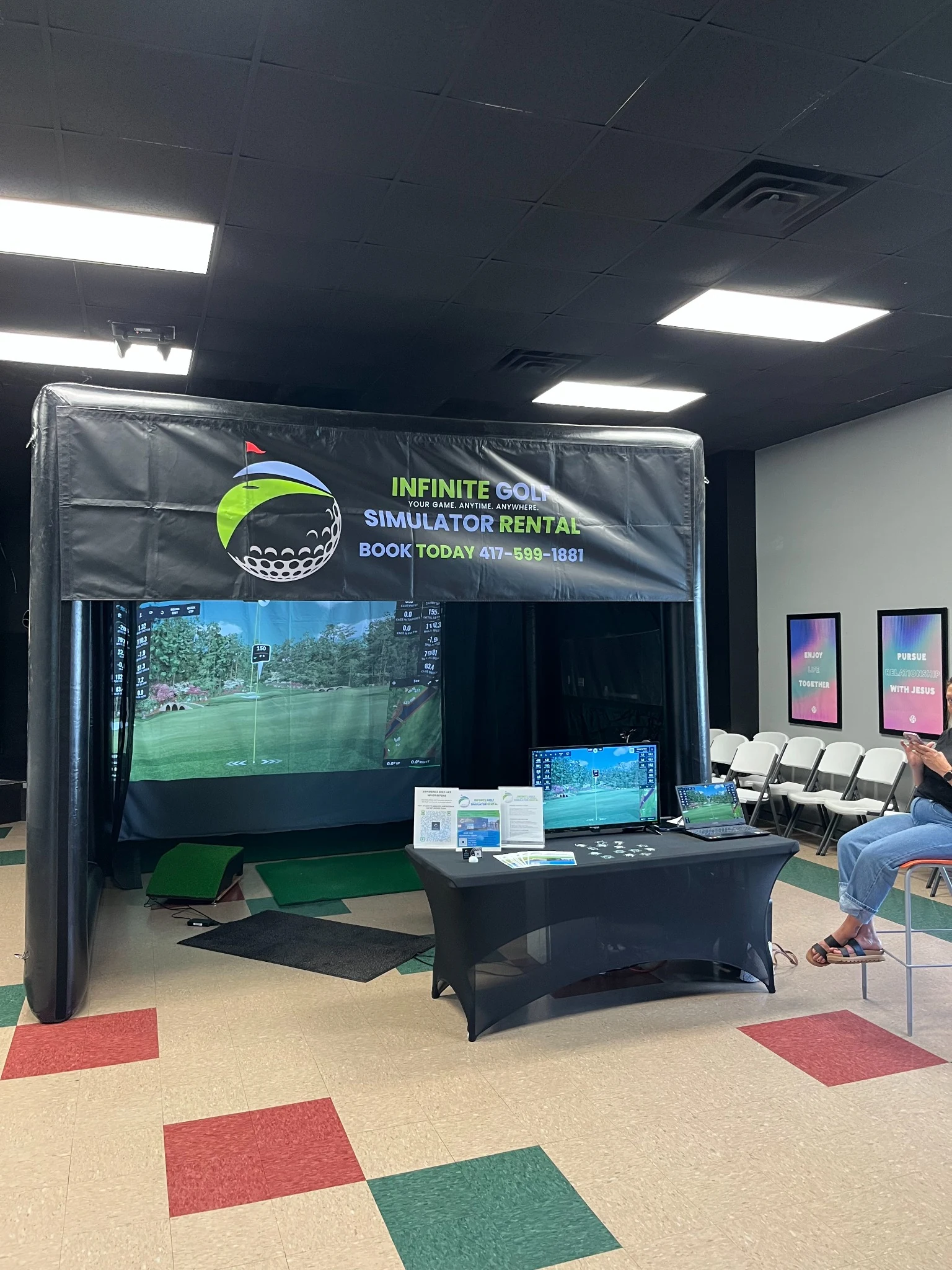 Infinite Golf simulator booth setup
