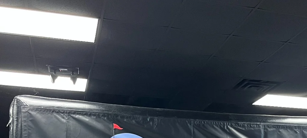 Fundraiser-ready simulator setup with Infinite Golf branding